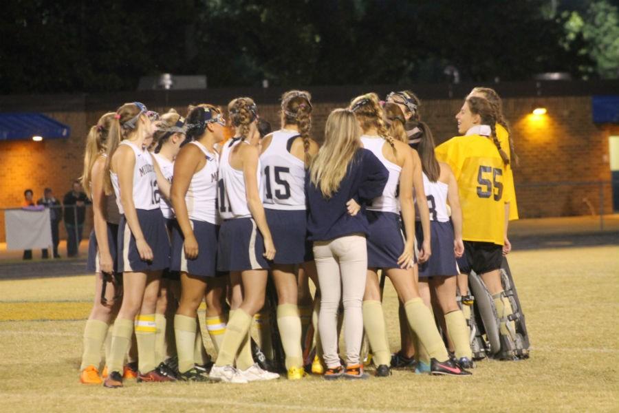 The team gets ready to chant their favorite cheer, ¨DONT MESS¨.