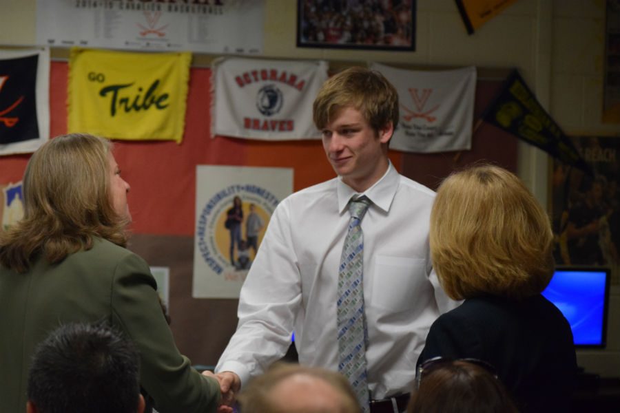 Mrs. Mulllins congratulates Lucas Via, new Inductee of National Business Honor Society.