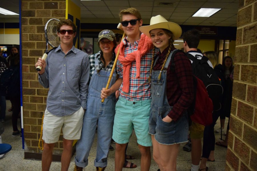 Tanner, Ally, Nick, and Mada proudly wear their spirit wear for Country Club vs. Country Day in the open commons.