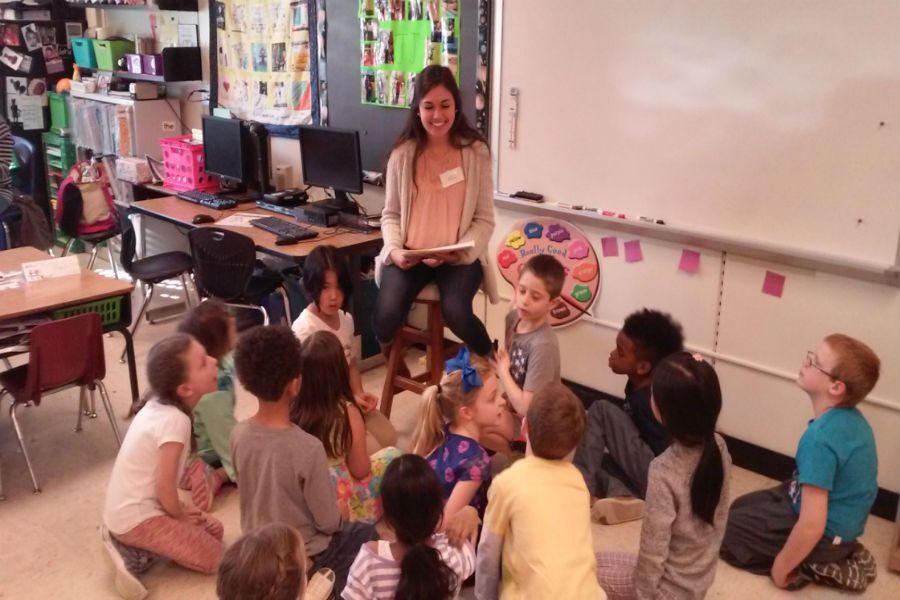 Bella Urcia reads childrens stories to her younger students.