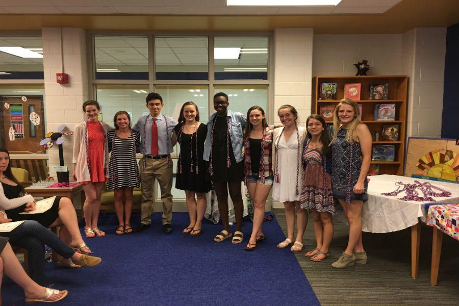 Société Honoraire de Français seniors humbly recieve their graduation cords of honor to commemorate their french achivements. 