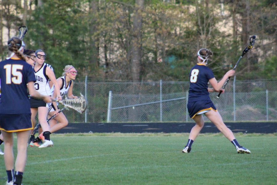 Star player, Natalie Webster winds herself up and prepares to score on the James River goalie.  