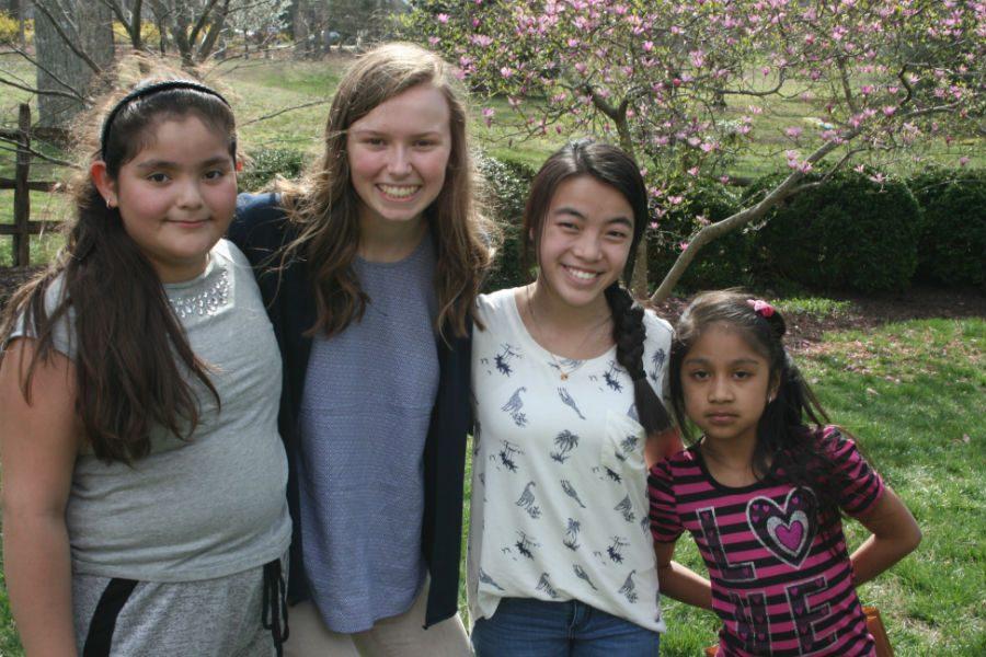 Phoebe and Chloe smile with their kids during the Easter Egg Hunt. Apply to become a Homework Helper today!