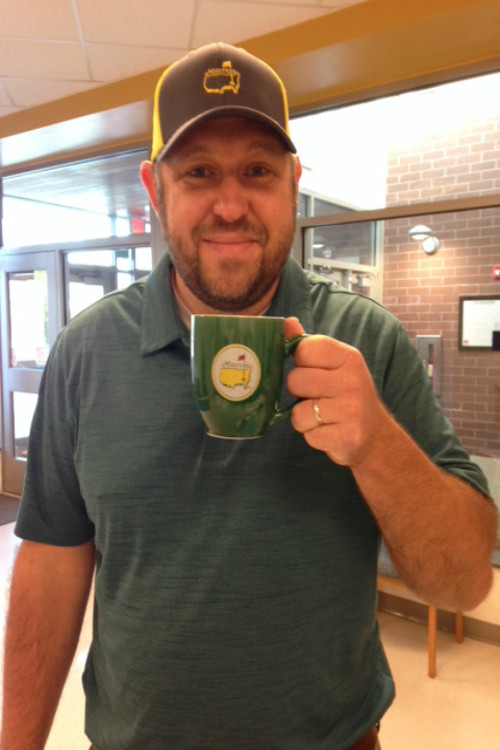 Mr. Steele poses with his Masters merchandise.