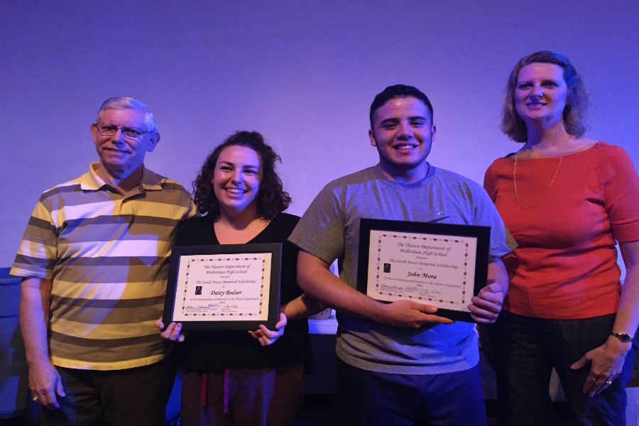 John Mora and Daisy Bedser hold up their scholarships standing next to Butch Eudailey and Mrs. Miller