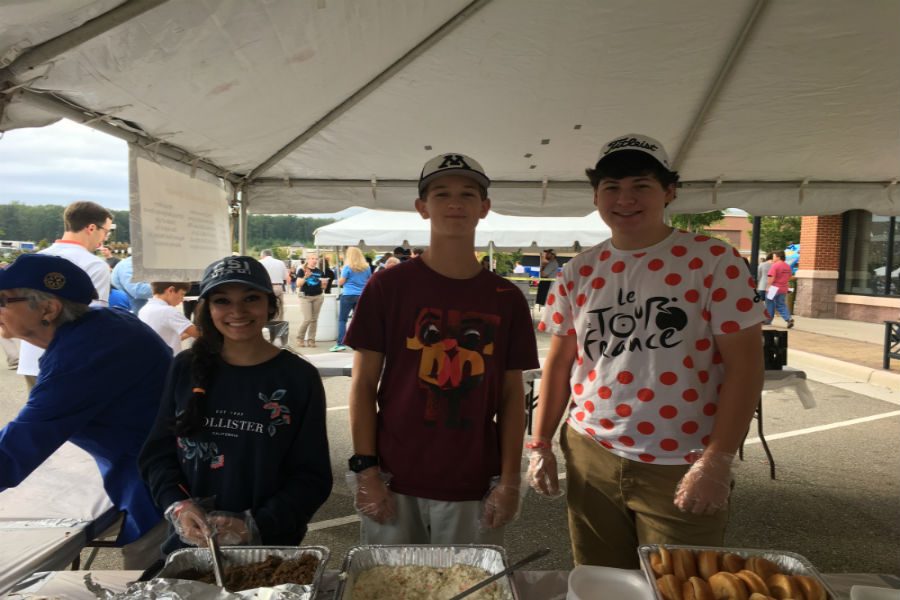 Midlothian juniors, Luke Manheim and Ryan Klaiber, work the barbecue stand at the Magnificent Midlothian Food Festival. 