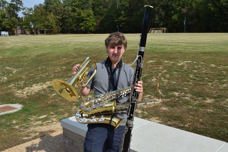Matthew Tignor stands with his arsenal of instrumentation.