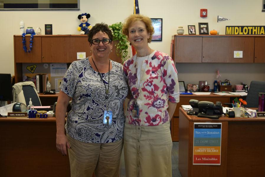 Mrs. Roberts and Mrs. Reynolds hold down the fort in the Midlo front office.