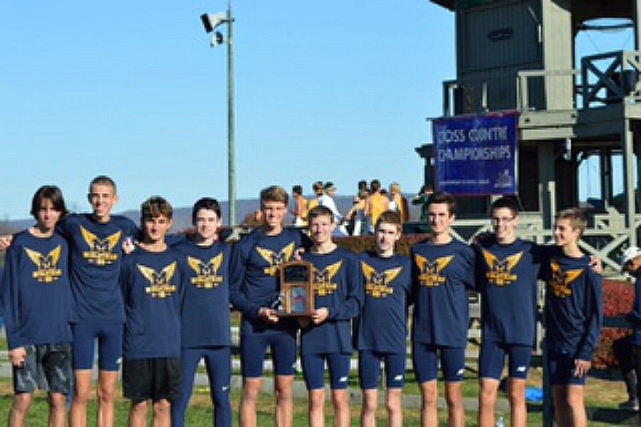 The Midlothian Trojans boys cross country team celebrate their 2nd place finish at the 4a VHSL State Championships.