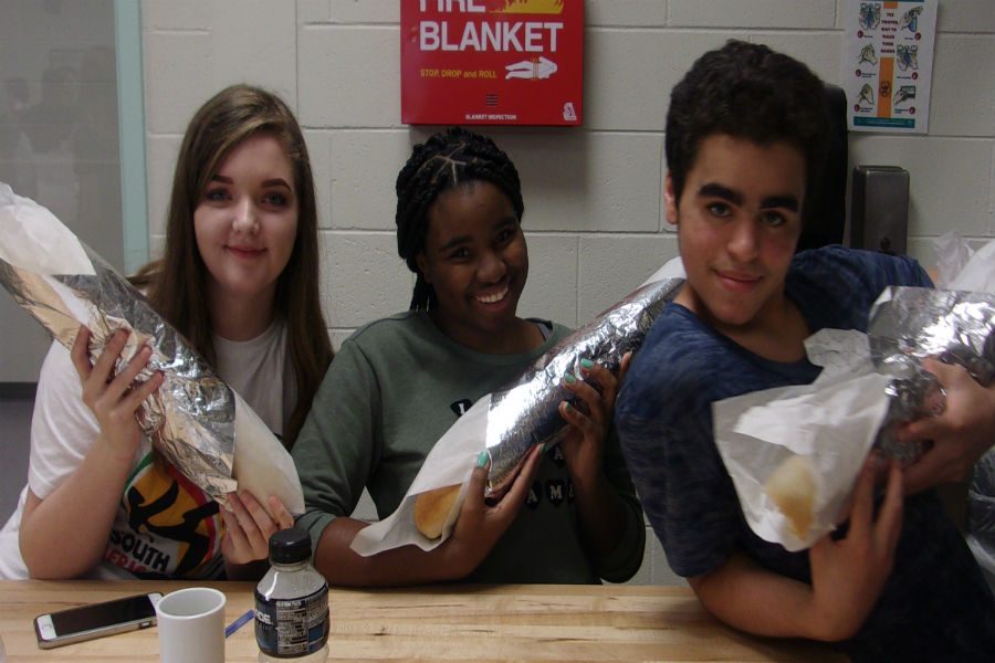 French 1 students flaunt their self-made bagettes.