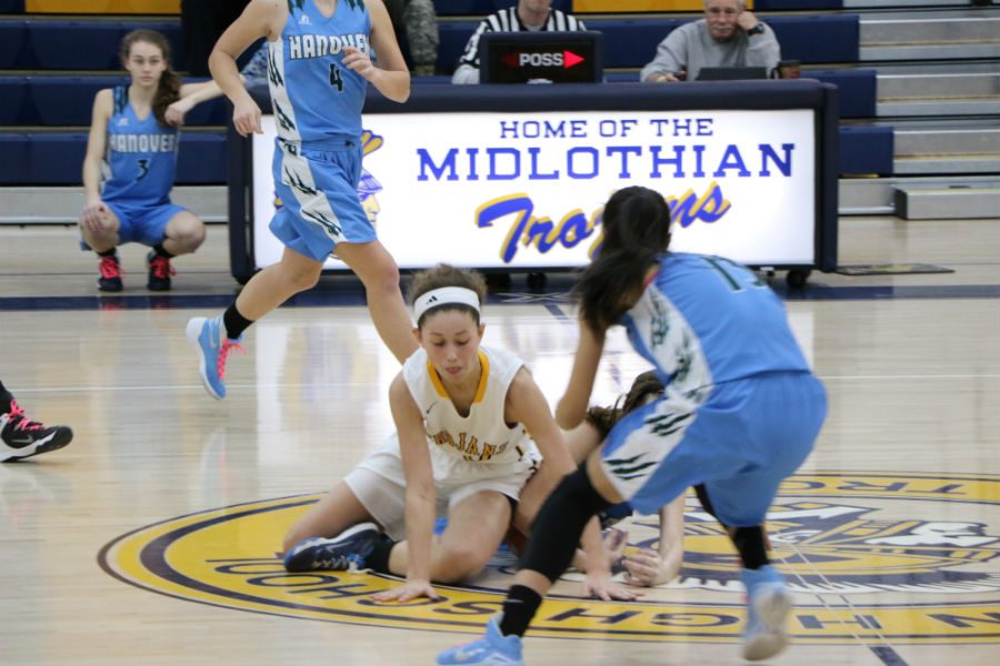 Senior McKenna Steele and the Midlothian Trojan girls have to fight hard to win this season.