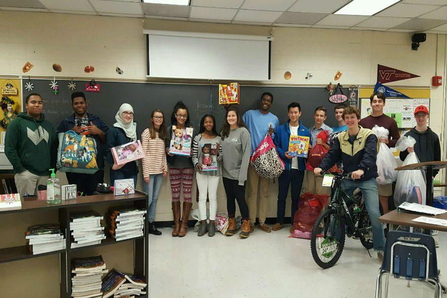 Mrs.++Manheims+1st+period+class+shows+off+some+of+the+gifts+given+to+the+Angel+Tree+effort.++They+were+very+excited+when+they+came+in+and+saw+the+bike+and+knew+their+generous+donations+helped+to+pay+for+it%21