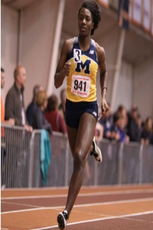 Madison Anderson sprints around the track at Virginia Tech.