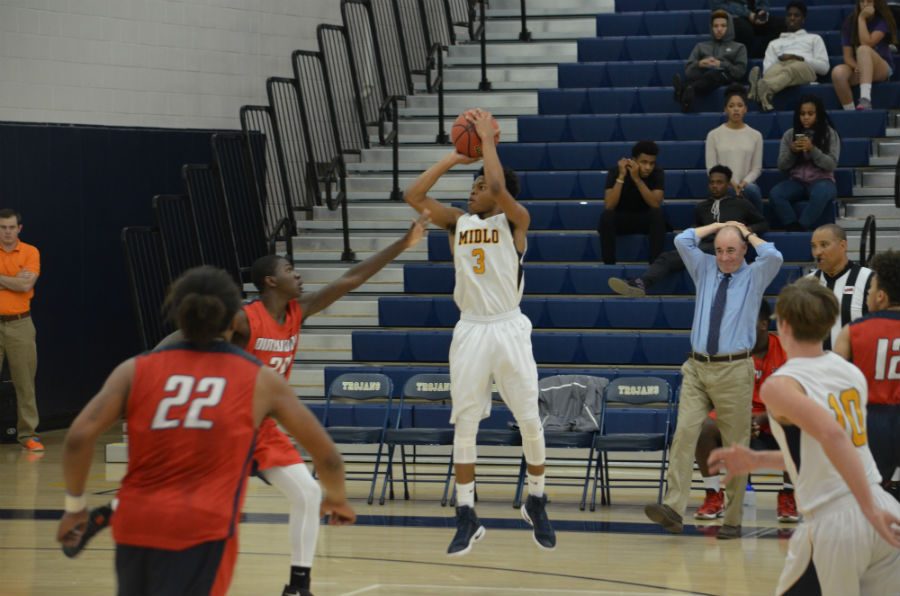 Rico Coleman (3) shoots over a Dinnwiddie defender