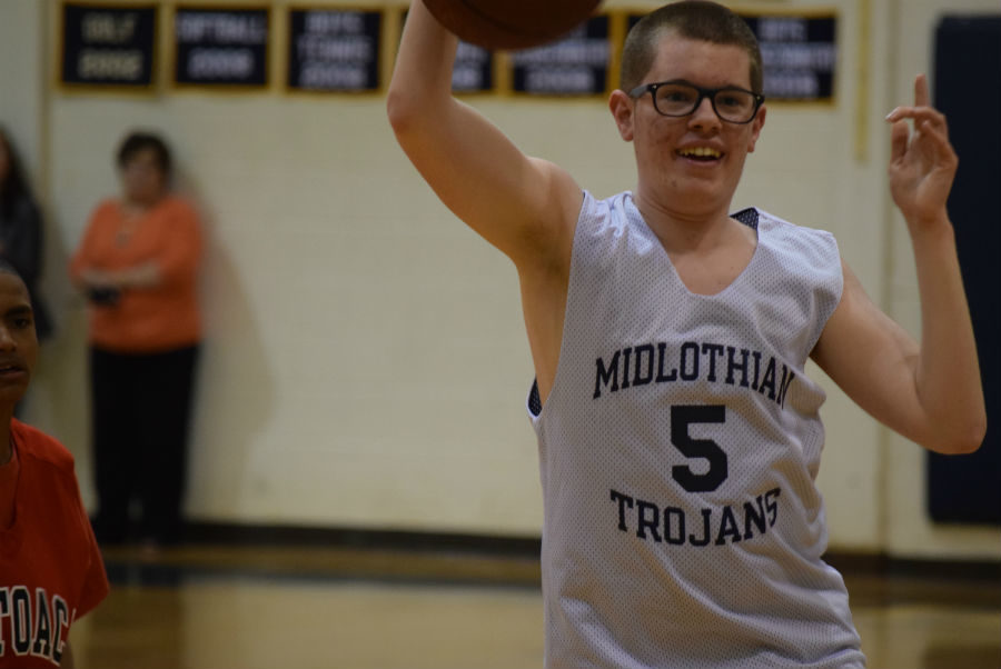 Jacob Phillips shows his love for the game of basketball.