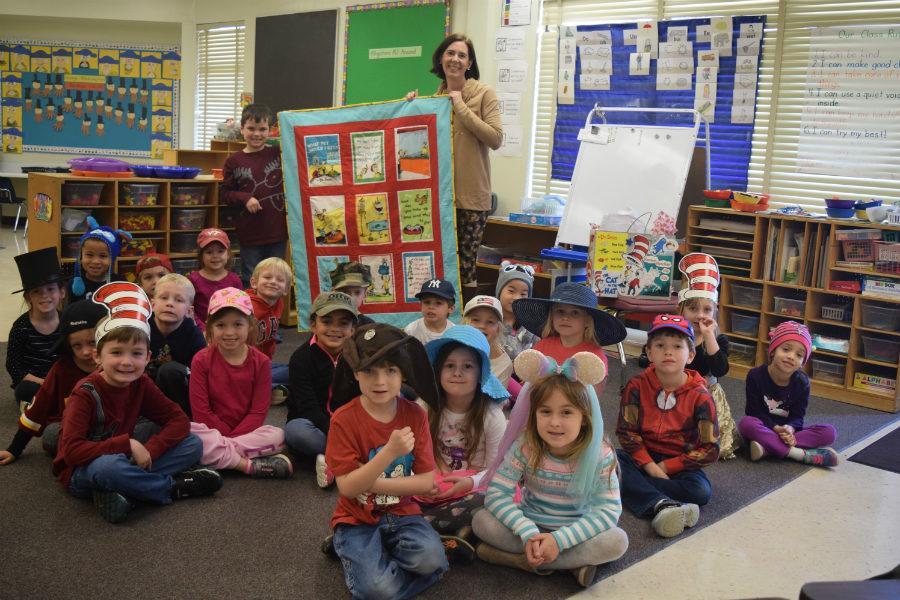 Mrs. Burnette shows off her new Which Pet Should I Get? quilt, donated by Midlothian High parent, Mrs. Diane Klotz. 