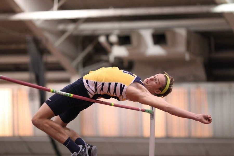 Lucas Via high jumps over the bar.