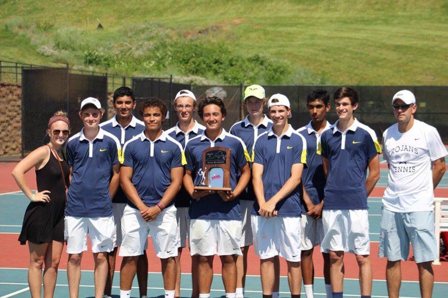 The 2015-2016 Varsity Boys Tennis team proudly holding their Regional Championship Trophy.  