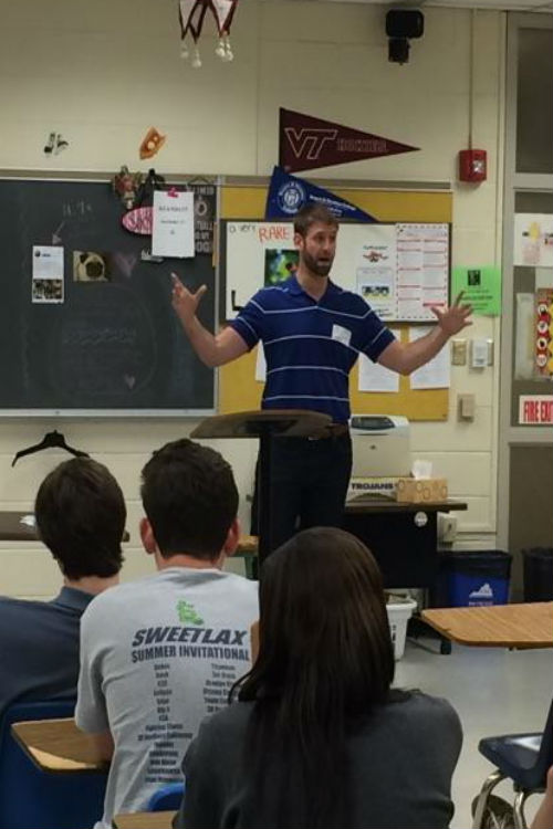 Mr. Andrew Thacker, property manager for S.L. Nusbaum Realty, tells students all about Sycamore Square.