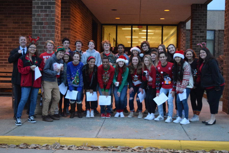 Members of the Principals Leadership Team deliver cookies, cocoa, and Christmas carols to bus drivers.