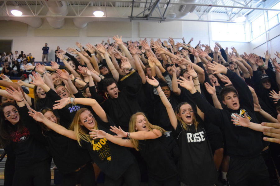 Seniors+show+off+their+famous+roller+coaster+cheer+at+the+winter+pep+rally.