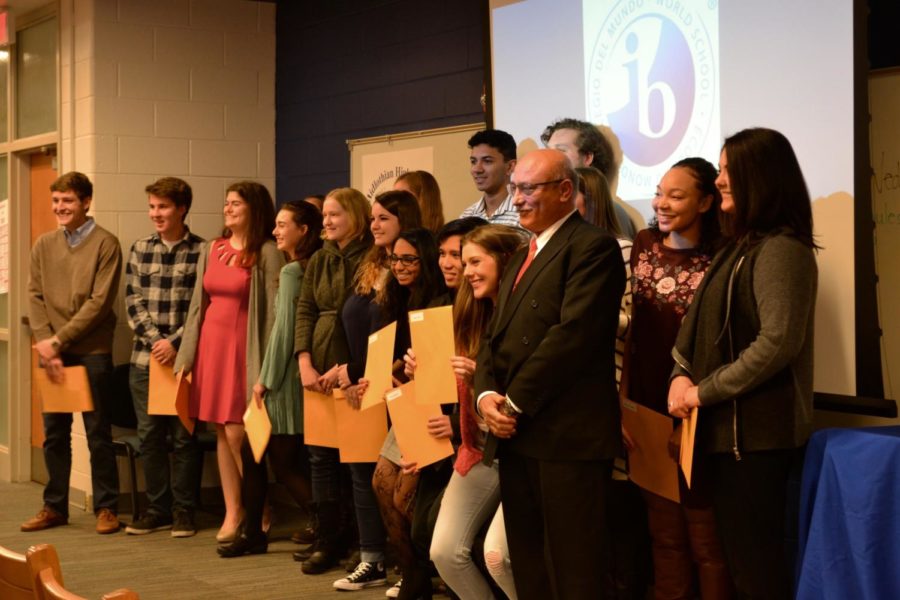 The IB Class of 2017 stand with their IB Diplomas & Certificates in hand.