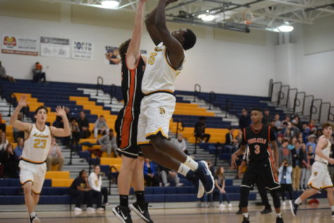 Trojans Men’s Basketball Wins Big in First Home Playoff Game in Years