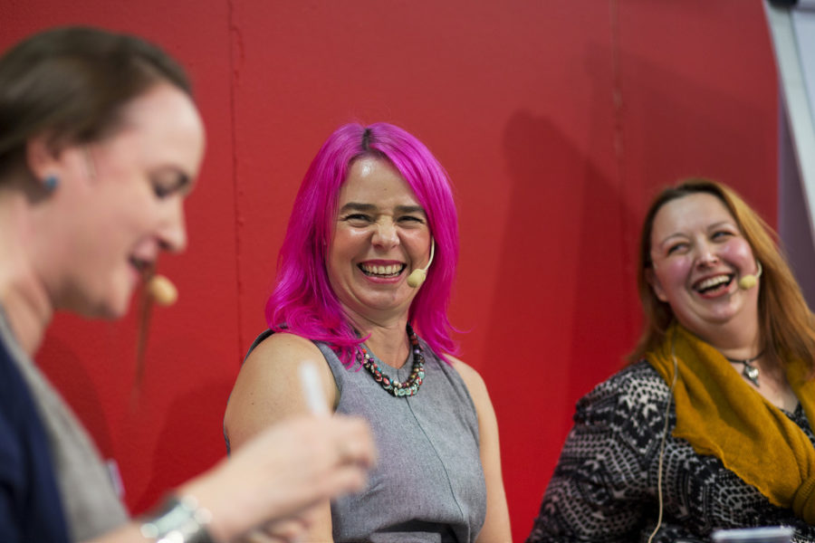 Laini Taylor conducts an interview at a literary conference. 