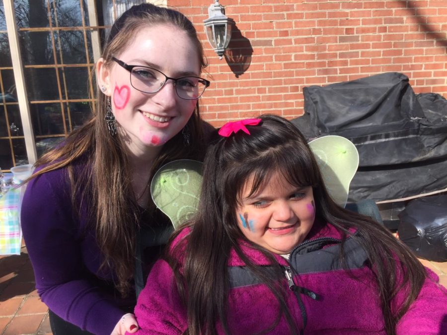 Homework Helpers Easter Egg Hunt: Kimberly Beasley enjoys face painting with her HH friend.