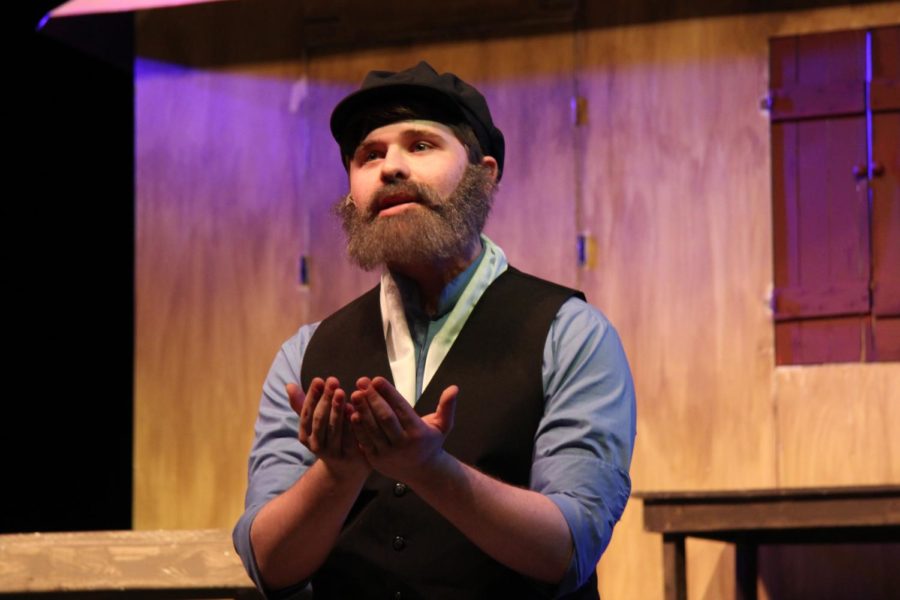 Tevye (Brent Novey) sings of the holy scriptures in If I Were a Rich Man.