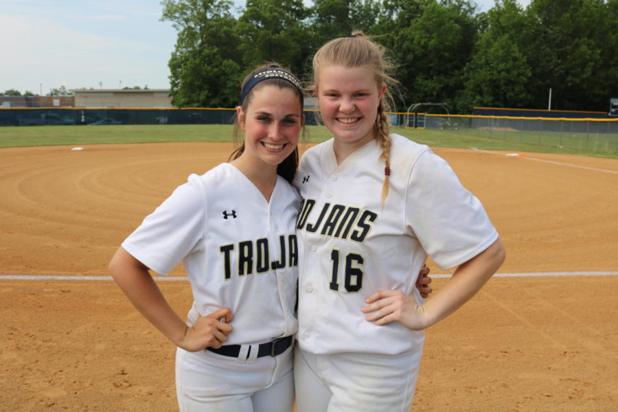 Haley Young and Morgan Gilbert smile for pictures on their senior night. 
