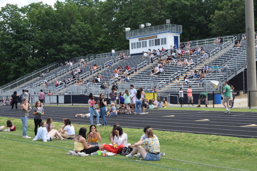 Midlo+students+gather+onto+the+football+field+for+the+annual+SCA+picnic.+