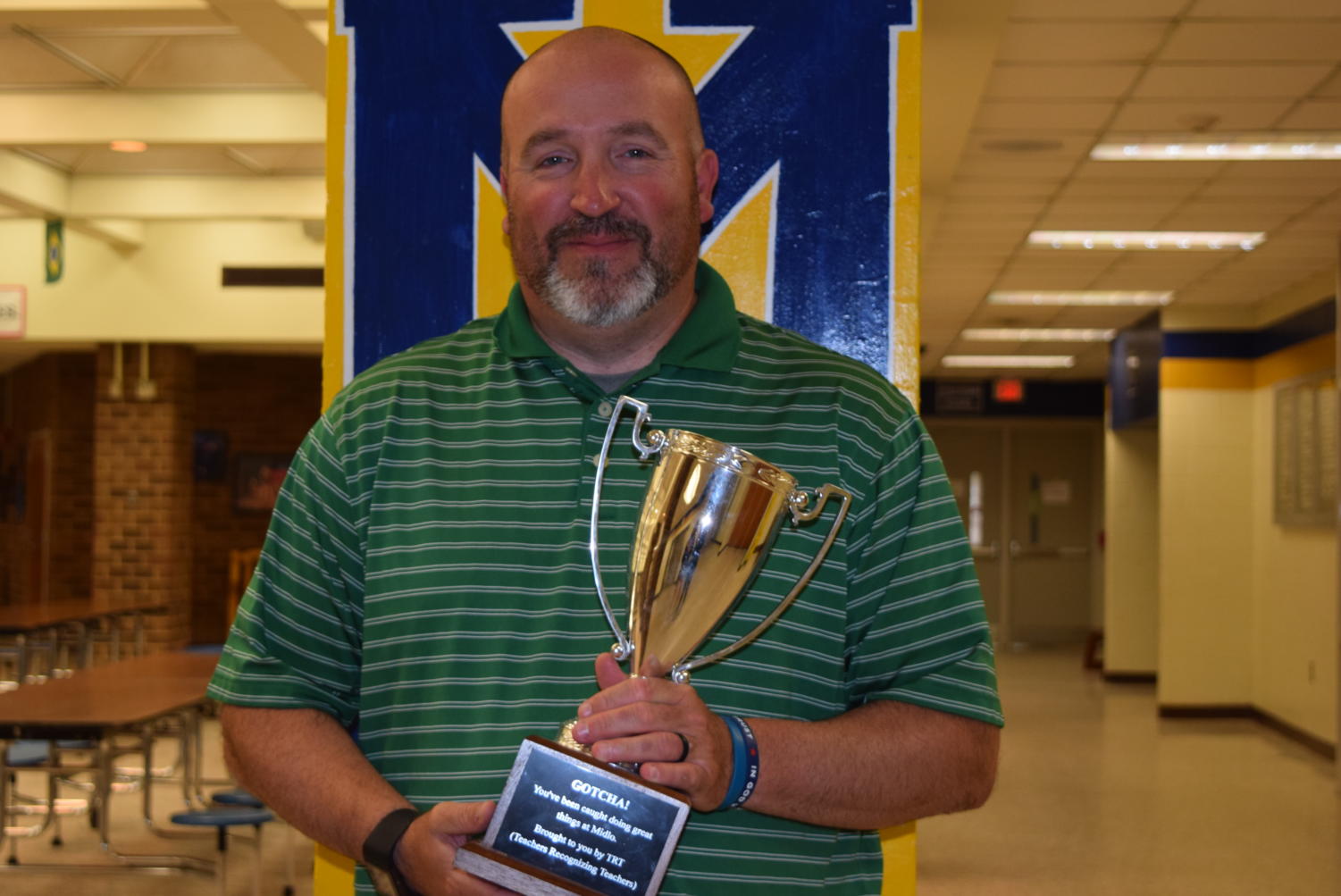 Mr. Kevin Thomas accepted the June Teachers Recognizing Teachers Award from Mrs. Manheim.