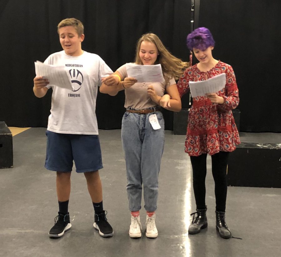 Cohen Steele, Kylie Redden, and Sophia Craig join arms to sing Were Off to see the Wizard!