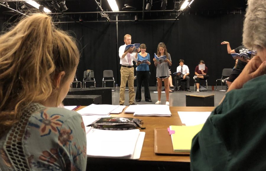 Mrs. Baugher and senior Peyton Strange follow along the script as Sophia Nadder, Yosef Collins, and Alexis Muse read it aloud.
