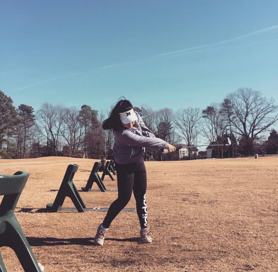 Junior Ester Choi prepares to compete in Golf States. 