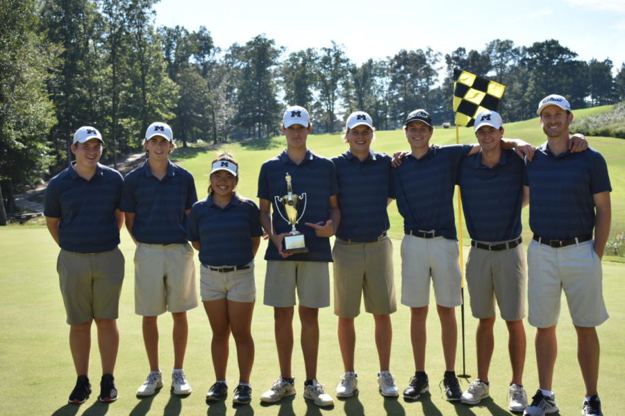 Midlo golf triumphantly celebrates their win in the Regional Tournament.