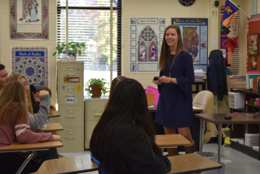 Senior council member Tori Bullis teaches her Trojan Nations group a lesson during homeroom.