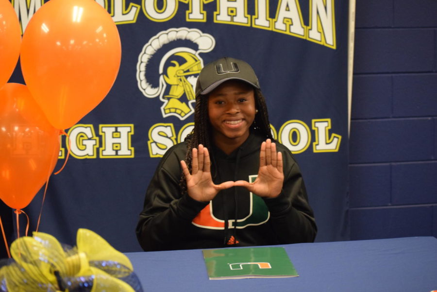 Midlo Senior Taylor Shell signs to play soccer at University of Miami on National Signing Day.