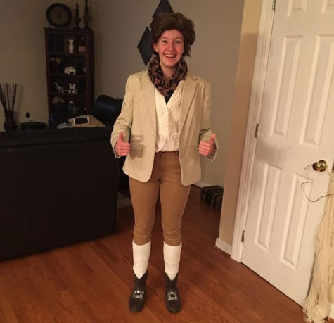 Chloe Martin adorns her costume as Jean-Jacques Rousseau for the Enlightenment PBL.