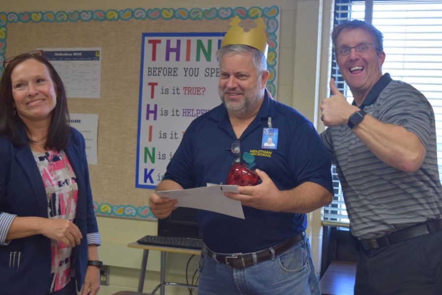 Mr. Abel and Ms. Bowes recognize Mr. Putnam as December Employee of the Month.