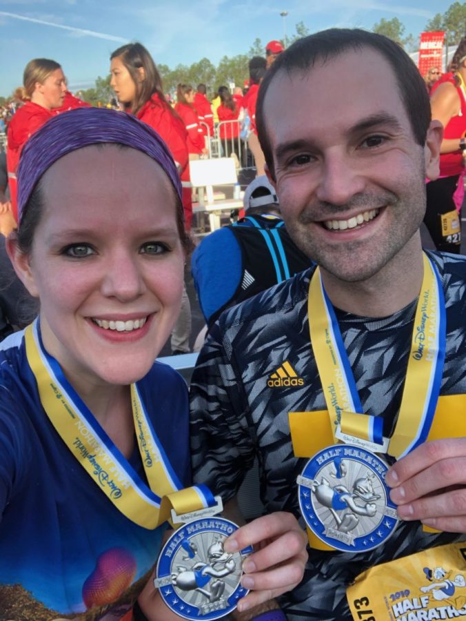 Mr. Anthony Bolton and his wife Ashlyn celebrate their finish after the Walt Disney World Half Marathon in Orlando, Florida.