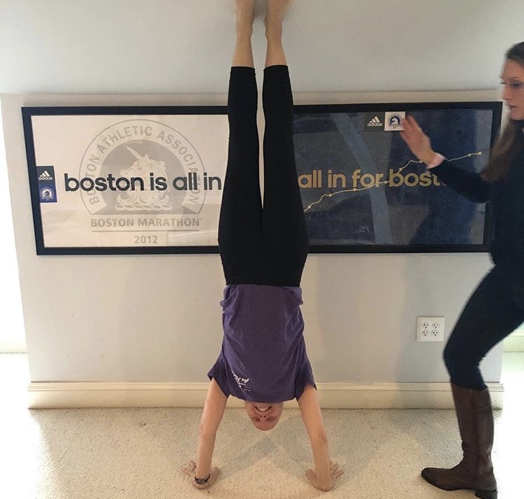 Emily Koski, the founder of Handstands for PanCan, completes a handstand in honor of pancreatic cancer.