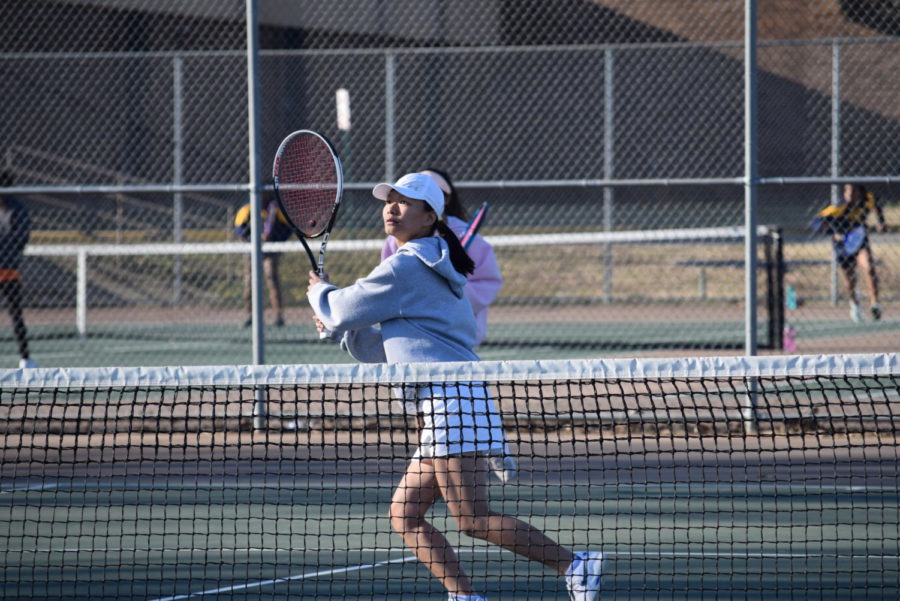 Sherinne Zhang prepares to send the ball back to her Monacan opponent.
