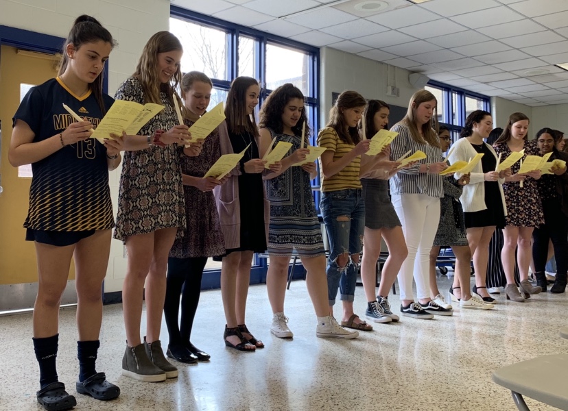 National Spanish Honor Society inductees sing the honorary song of MI LLAMA by Eugenia Munoz.