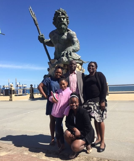 Vongai Zhandira celebrates gaining her citizenship with her family in Virginia Beach.
