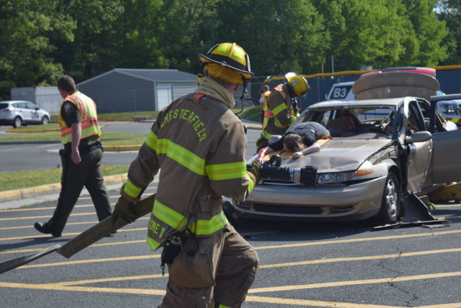 First Responders rush to the scene with a fire hose during Project Impact.