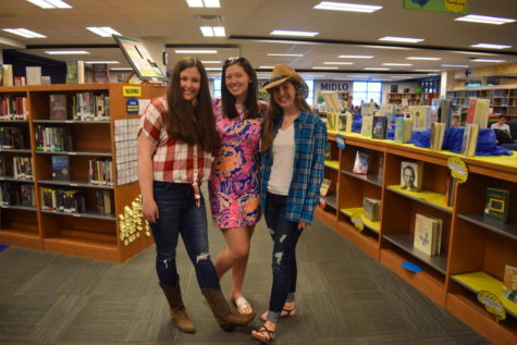 Grace Wells and Elizabeth Czenczeks country outfits clash with Morgan Sensabaughs country club style during Senior Spirit Week.