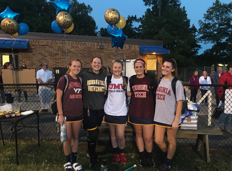 Midlos senior lacrosse players gather after a game against the Godwin Eagles on Senior Night 2019. 