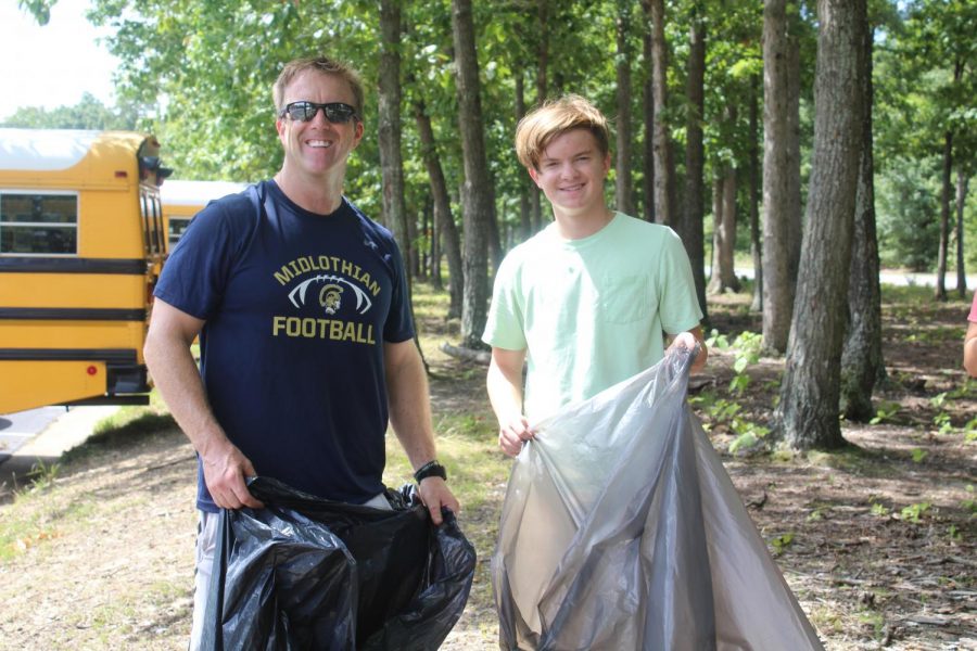 Principal Shawn Abel and his son, Jackson Abel, team up to beautify Midlothian High School.